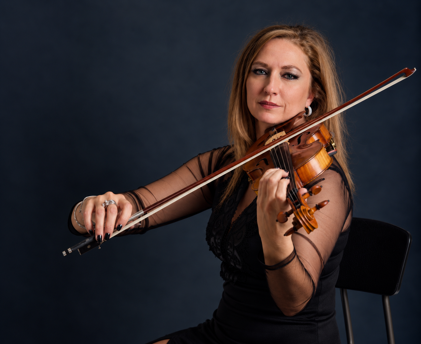 Elegant Violinist in Studio Light
